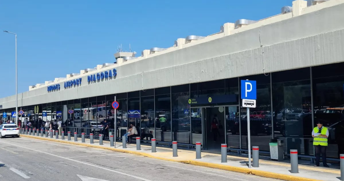 Rhodes Airport Diagoras terminal exterior, with the airport sign, public entrance and roadside transport area.