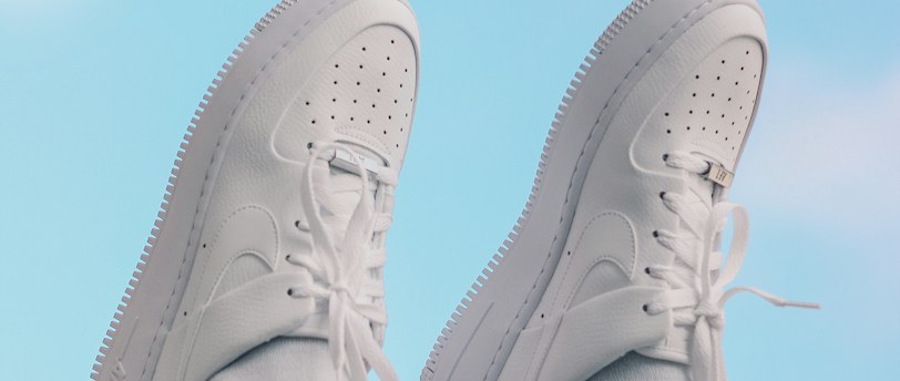 Close-up of white trainers suitable for walking on stone streets